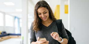 Student on campus using a mobile phone